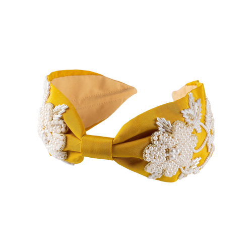 JOYCO Alessia yellow satin headband with pearl and bead embroidery and a knot detail.